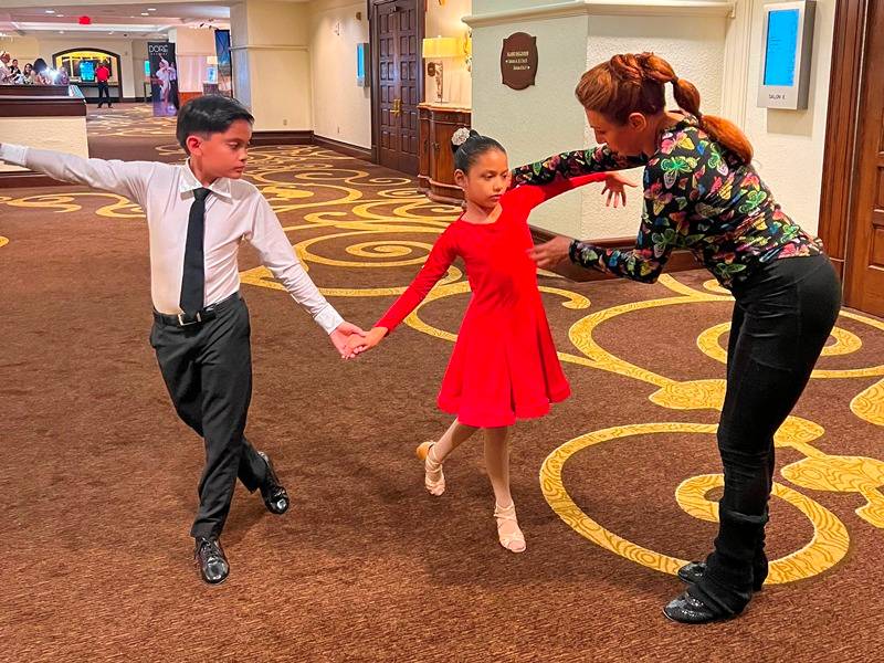 Jeanette coaching dance students at competition